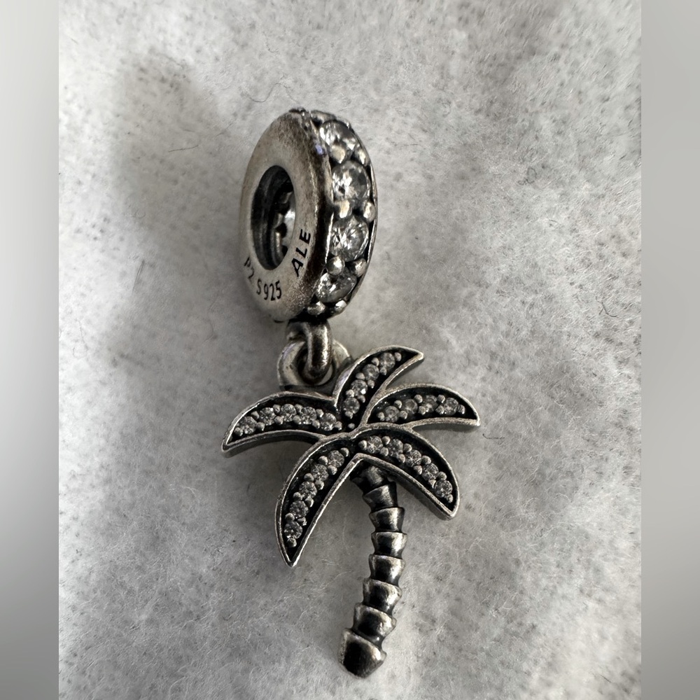 Pandora Palm tree dangling charm with little crystals.
